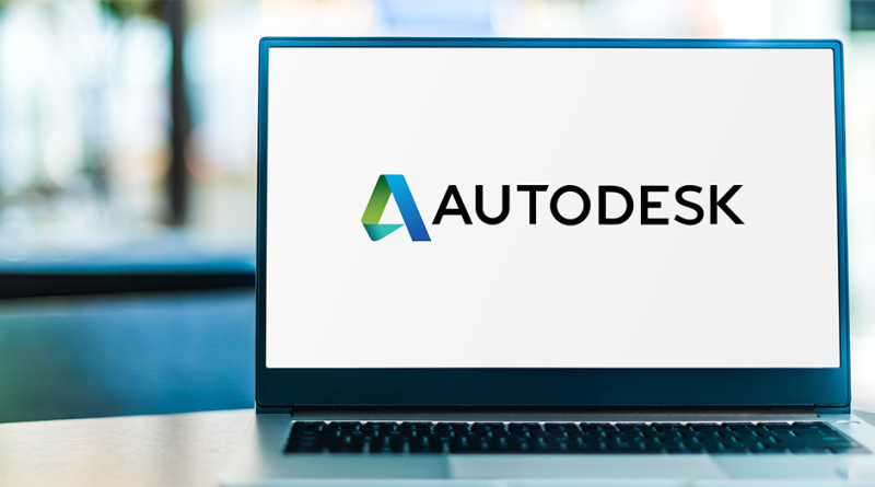 Image of a laptop sat on a desk with the Autodesk logo displayed on the screen to support Autodesk Construction Cloud article