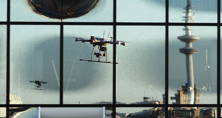 two drones seen through a window