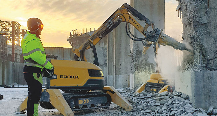 Brokk 500 with breaker demolishing a wall