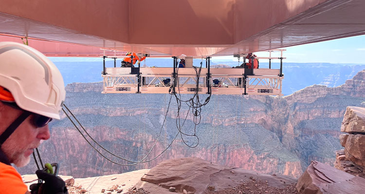 Workers cleaning underneath grand canyon skywalk