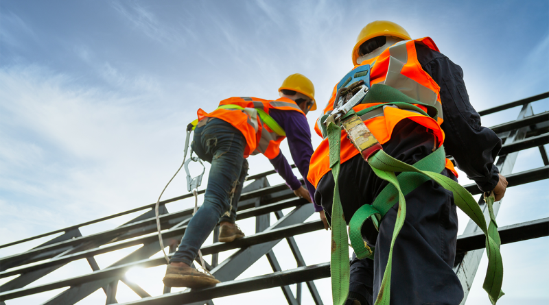 Construction labor workers on scaffolding