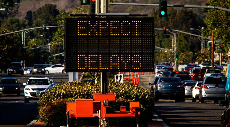 Project Stress Index Rises 11.4% in May Amid Increased Abandonments Expect delays sign in heavy traffic construction area
