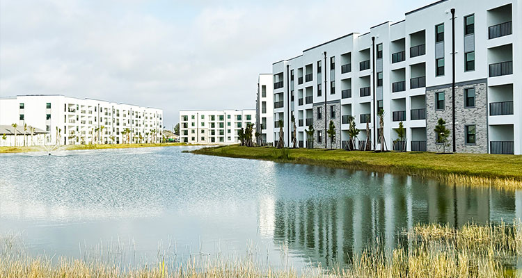How Service Contracting Solutions’ innovative approach to staff development has fueled expansion Estero Vista Apartments, a residential community featuring modern buildings set around a body of water