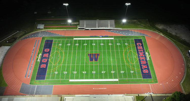 How American Athletic Track and Turf leverages decades of experience, laser-controlled technology, and its highly skilled team to build elite athletic facilities the football field at Willingboro High School