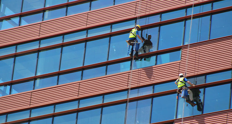 Through strategic partnerships and innovation, the Valcourt Group is delivering complete building façade solutions that protect and preserve high-rise window cleaners working on a modern building
