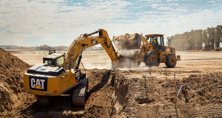 At L&S Construction, employee ownership means every success is truly shared wo pieces of Caterpillar (Cat) heavy equipment on a construction site