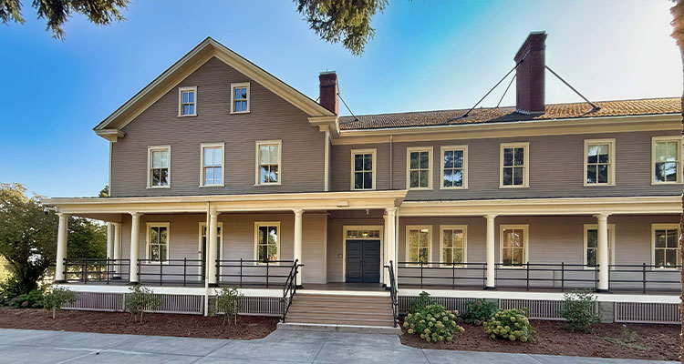 From paper mills to NASA facilities, Pacific Tech Construction is building America’s future a two-story, L-shaped building with a wide porch that extends across the front.