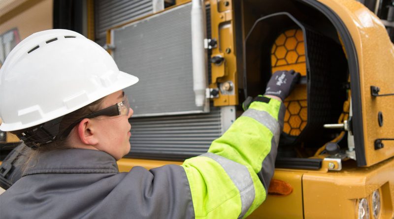 The science of strategic equipment maintenance schedules in harsh environments Team member at Warren CAT working on machinery