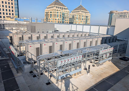 a rooftop installation of multiple air conditioning units or heat pumps