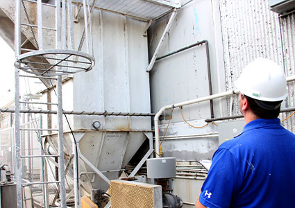  a worker inspecting industrial equipment