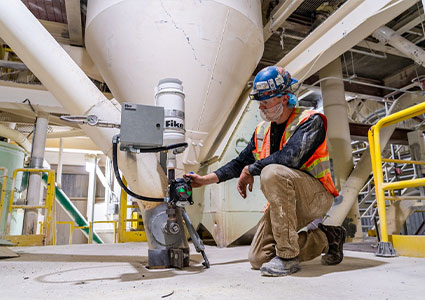  a Fike service technician servicing industrial safety equipment