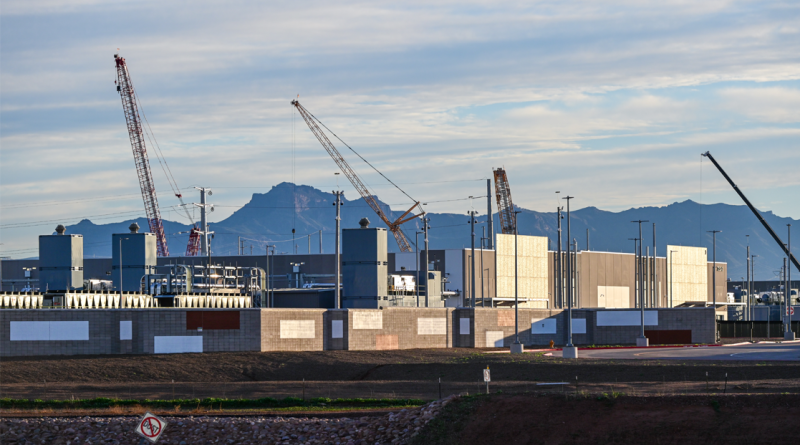Downloaded File #: 1817716692 Large data center campus with completed buildings and active construction zones,