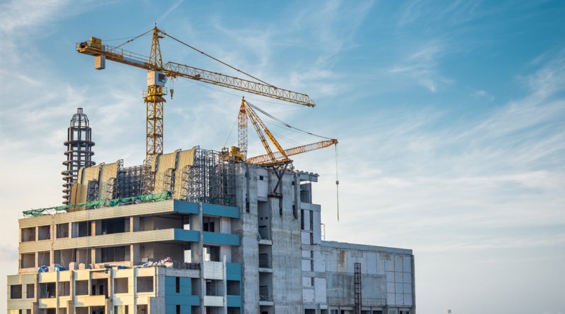 Modern building and tower crane in construction site