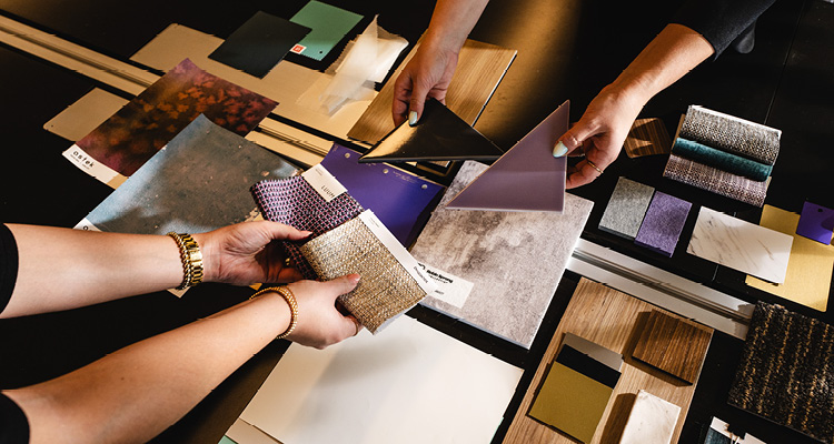 textile samples featuring a textured gold weave and a purple geometric pattern.