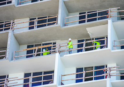 workers on an 11-story apartment tower construction site