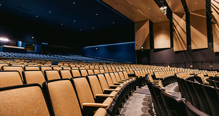 the interior of a large, modern auditorium or theater hall