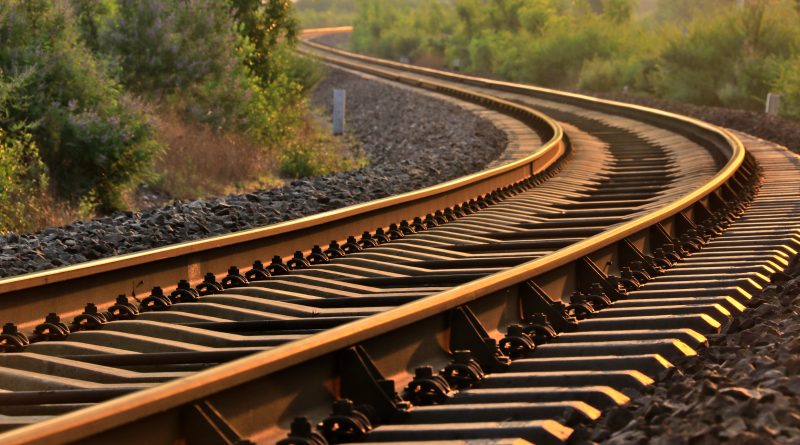 Railway at sunset representing infrastructure modernization work.