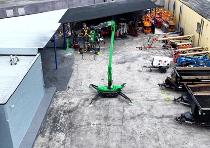 The Leguan 225 is a green tracked spider lift with a maximum working height of 22.5