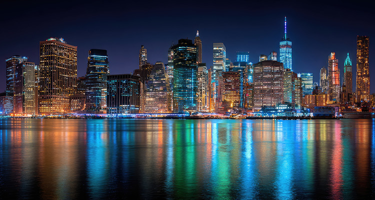 a nighttime photograph of the Manhattan skyline