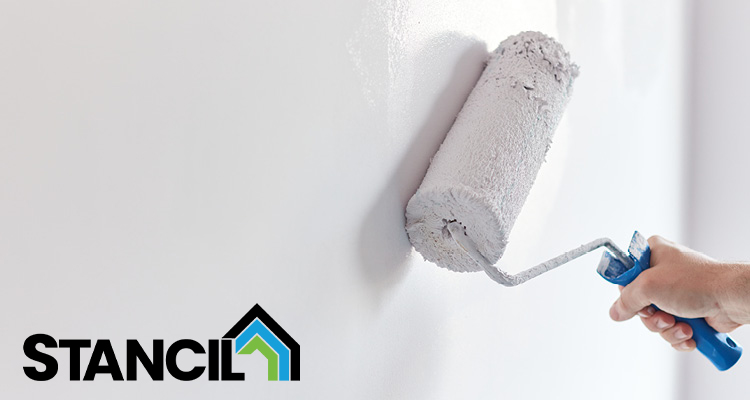 a hand holding a blue handled paint roller applying white paint to a wall, accompanied by a STANCIL logo