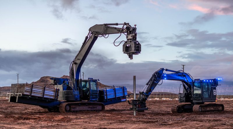 Built Robotics' autonomous construction robots install steel foundation piles at a utility-scale solar farm supporting AI data center infrastructure.
