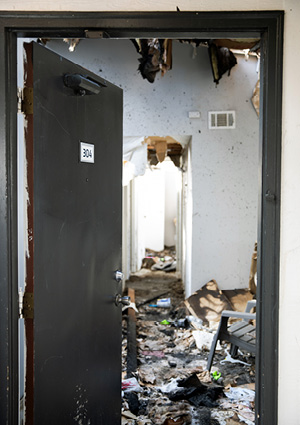 Looking into an apartment damaged in a fire