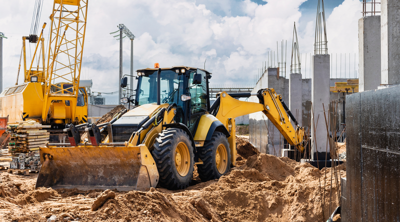 Excavator digs piles. Earthworks for the construction of the foundation.