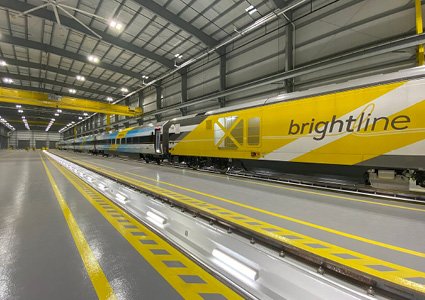 a Brightline high-speed train inside the Basecamp Vehicle Maintenance Facility