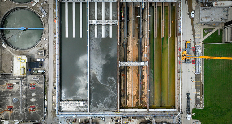 an aerial view of rectangular aeration or secondary treatment basins at a wastewater treatment facility