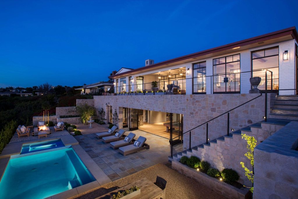 Multi-panel steel doors open a lower level to a pool terrace at an Orange County, California, residence (solid steel, patina finish). Architect: Ritner Group. Riviera Bronze lists swinging, sliding, folding and pivot door systems.